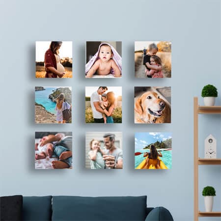 Nine glass picture tiles on a blue wall.