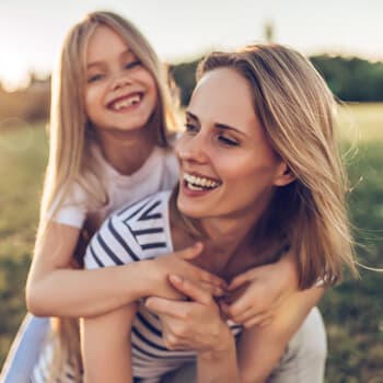 Mom and daughter laughing