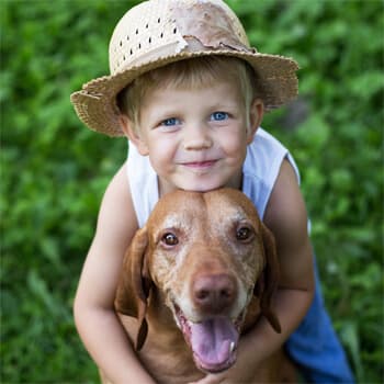 An adorable kid and his dog