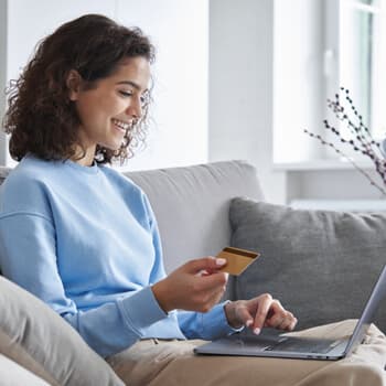 A woman shop online for picture tiles. 